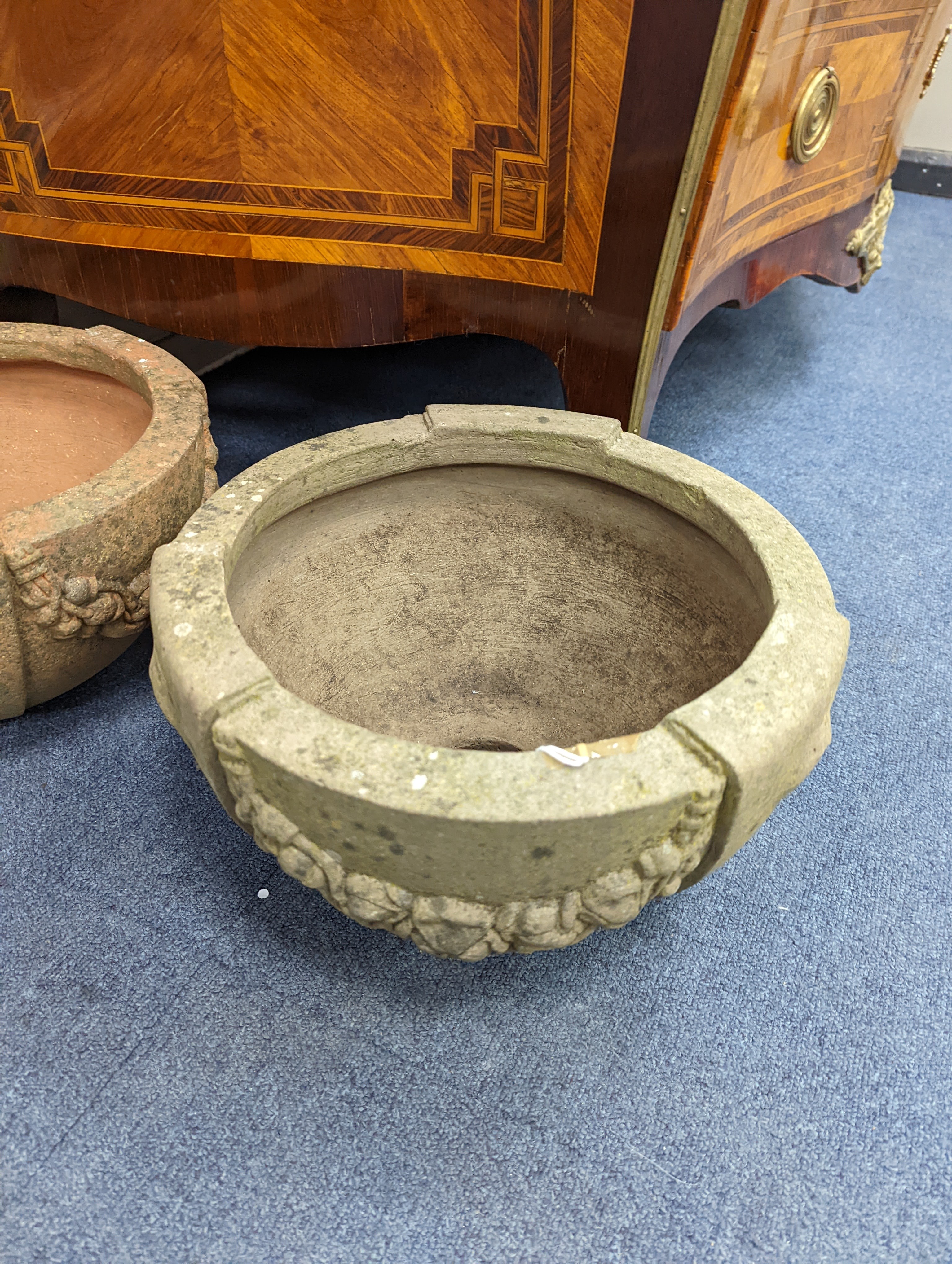 A pair of Compton terracotta poppy pattern planters, diameter 34cm, height 19cm